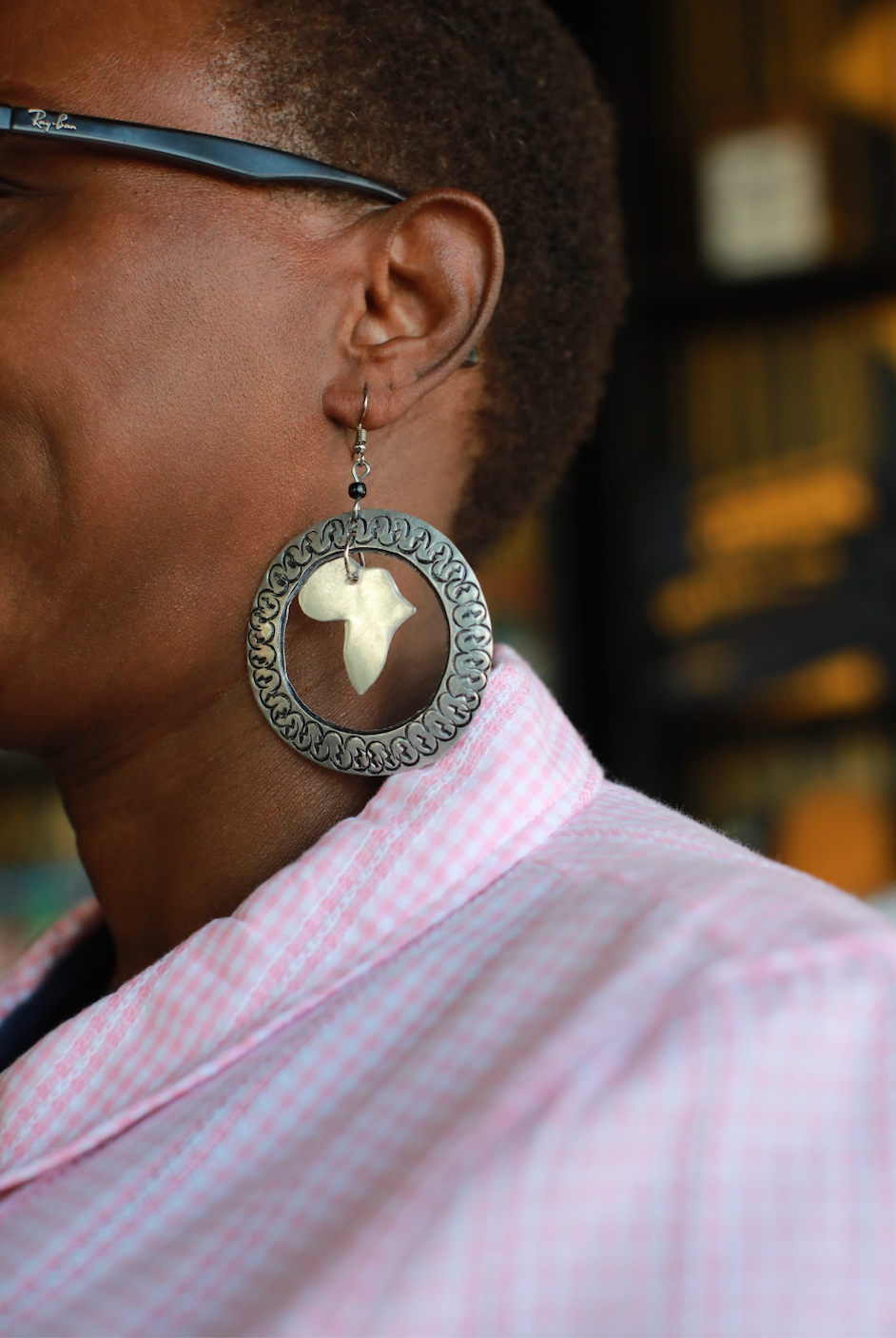 Woman wearing silver round earrings